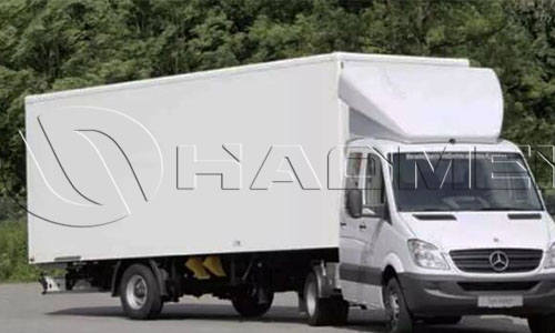 A trailer of white painted aluminium sheet